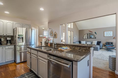 With its spacious layout, top-of-the-line appliances, and stylish finishes, this inviting space is perfect for everything from morning coffee to gourmet dinners.
