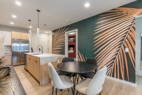 Unit 1: Dining table set to accommodate up to four guests.