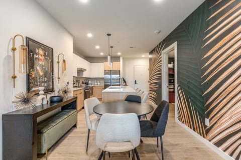 Unit 1: Dining table set to accommodate up to four guests.