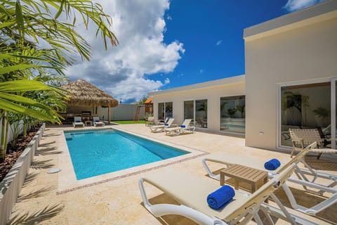 Imagine lounging by a private pool, basking in the tropical sun, surrounded by luxury.  Whether taking a refreshing dip or relaxing on a lounger, every moment is designed for your comfort and enjoyment.