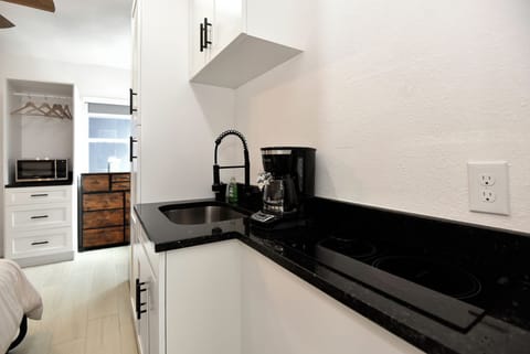 Newly renovated kitchen with coffee maker.