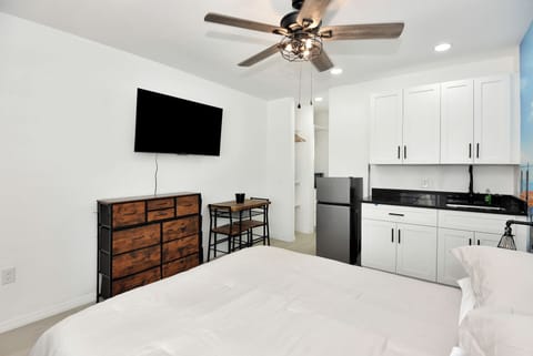 Ceiling fan over bed