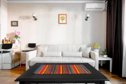 Relax and unwind in the cozy lounge area. Test out our super comfy click-clack couch—whether for a nap or just lounging under the funky artistic ceiling!