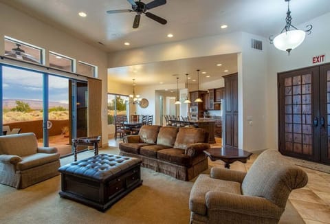 Enjoy the tranquility of desert views in this spacious living room, designed with an open floor plan that encourages togetherness.