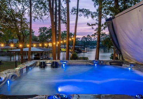 Unwind in the lakeside hot tub, perfectly positioned just steps from the water's edge. Surrounded by nature and stunning views, it's the ideal spot to soak, relax, and take in the peaceful beauty of the lake—morning, noon, or under a star-filled sky.
