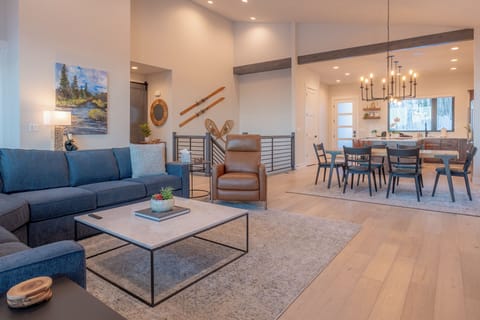 An elegant staircase connects the main level to the lower level retreat.