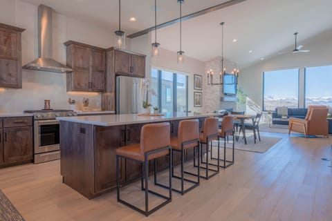 Bright and open living space with expansive windows showcasing stunning Rocky Mountain views.