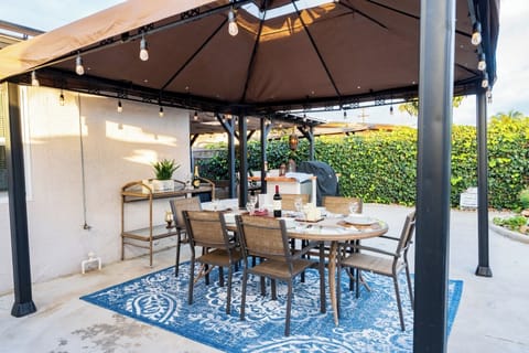 Outside Dinning table seats 6 with string lights for evening dining.