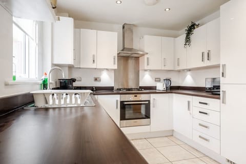 Kitchen. Fully equipped with cooking equipment perfect for families. Appliances such as fridge freezer, microwave, cooker, oven, dishwasher Toaster are free and available for your use.