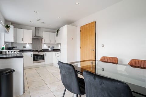 Kitchen. Fully equipped with cooking equipment perfect for families. Appliances such as fridge freezer, microwave, cooker, oven, dishwasher Toaster are free and available for your use.