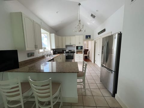Kitchen Bar area with three bar stools