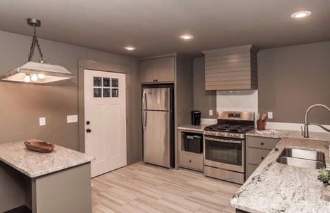 A stunning space with a spacious island for both preparation and gathering.