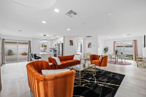 Bright open living area w/ plush seating, modern finishes & an easy flow for relaxing or gathering together.