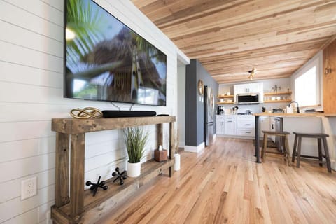 Second living space off the kitchen and back patio. Features a 70 in HD TV