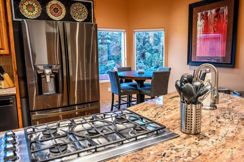 5 burner stove with pop up venting and breakfast nook with seating for 4