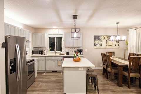 Open fully equipped kitchen with large island is perfect for a cooking show