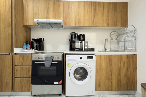 A fully equipped kitchen designed to make cooking a delight with modern appliances.