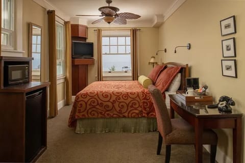 Stretch out in a cozy bedroom with sunny corner windows.