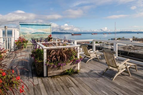Unwind on the rooftop deck with sweeping ocean views.