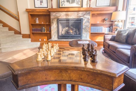 Challenge friends to chess beside the crackling stone hearth.