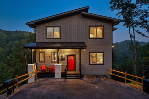 Front exterior & driveway for plenty of parking. Charcoal BBQ grill on the side