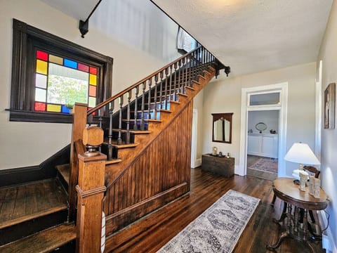 Antique steps leading upstairs from the foyer