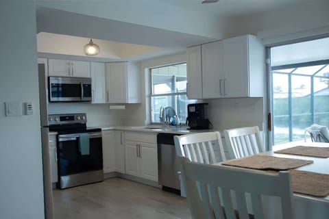 "Whip up your favorite meals in this modern kitchen with stainless steel appliances and all the essentials."