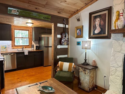 Cozy corner with surrounded by the homeowner`s artwork.