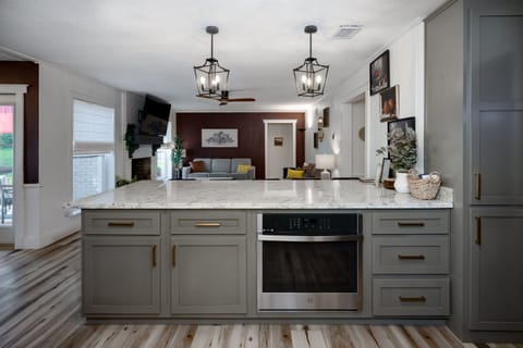 Serve, snack, socialize—our large bar opens straight into the living room!