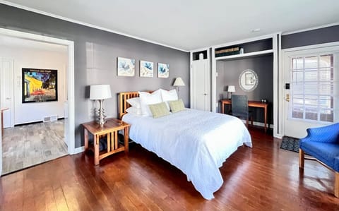 Enjoy variable lighting, pillows for propping, and crisp, clean bed linens enveloping a comfortable Casper queen mattress for a restful sleep. The curtains are lined for privacy and room darkening. 