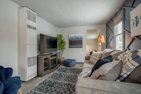 - Cozy living room with comfy seating stylish accents and a large smart TV for guests   - Soft textures and warm lighting create a relaxing stay ready for movie nights   - Perfect lounge space for unwinding after exploring local attractions