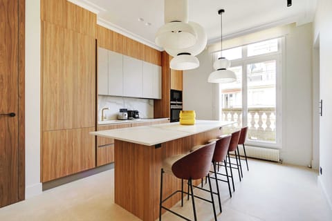 A magnificent,fully equipped& functional kitchen,with a bar table .