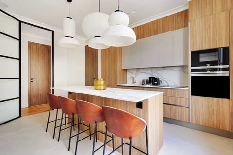 A magnificent,fully equipped& functional kitchen,with a bar table .