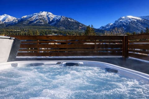 Soak in the incredible mountain views and enjoy your private outdoor hot tub after a day of exploring.