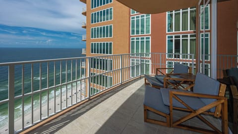 Lounge on the balcony overlooking the refreshing pool and beach area and nap with the sound of waves and seagulls