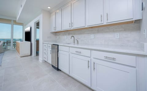 Grab a chilled drink from the fridge or create your favorite cocktail at the wet bar