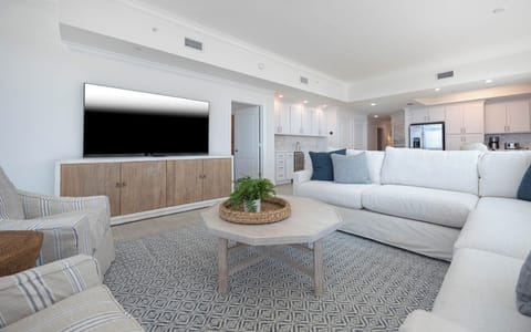 Stretch out on the roomy couch and stream your favorite shows on the large TV