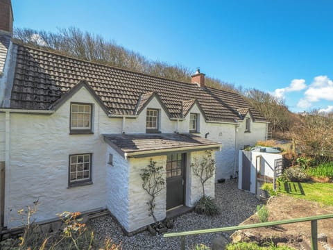 Outside view of the cottage. Big open space front garden