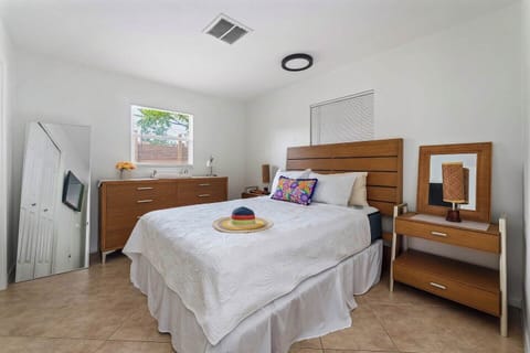 Relax in this cozy and inviting bedroom, designed for comfort with soft linens and a peaceful ambiance for a restful night’s sleep.