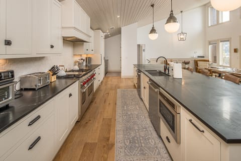 Fully equipped kitchen offers two dishwashers, a full gas range, and a coffee bar. Perfect for large groups | Upper Level