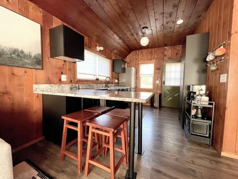 Kitchen Peninsula: This is used as the dining table.