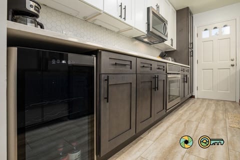 wine cooler this end, large pantry far end