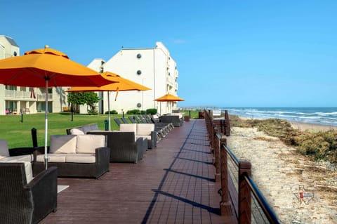 Relax in a shaded seating area by the beach.