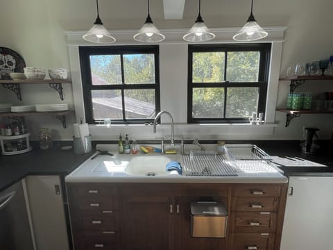 Gourmet kitchen with old farm sink and custom cabinets.