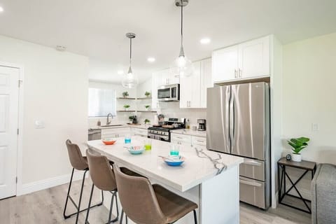 Modern kitchen space, equipped to accommodate your cooking needs. 