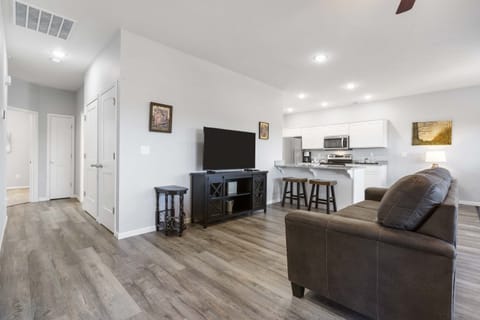 Living space with queen sofa sleeper and Smart TV