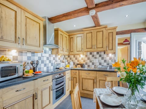Kitchen/diner | Bryn Awelon Bach - Moelfre Cottages, Moelfre, near Benllech