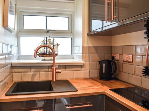 Kitchen area | White Mermaid - White Cottages, Newborough