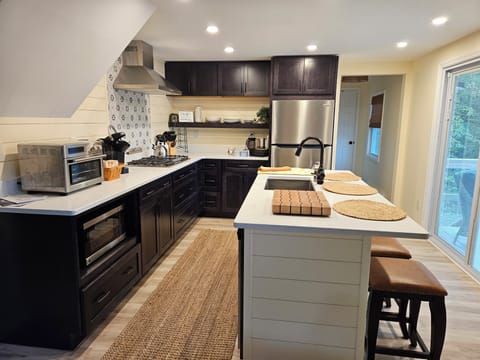 full kitchen including a water cooler