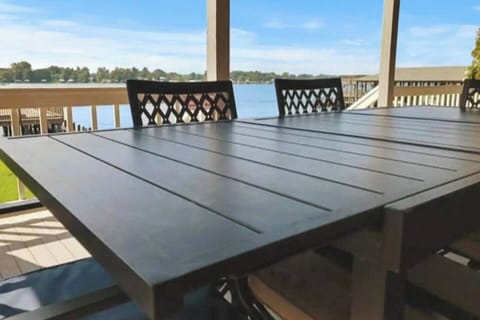 [Lower Level Porch] When grilling is done, serve dinner right on the covered porch with wonderful vistas of the lake.